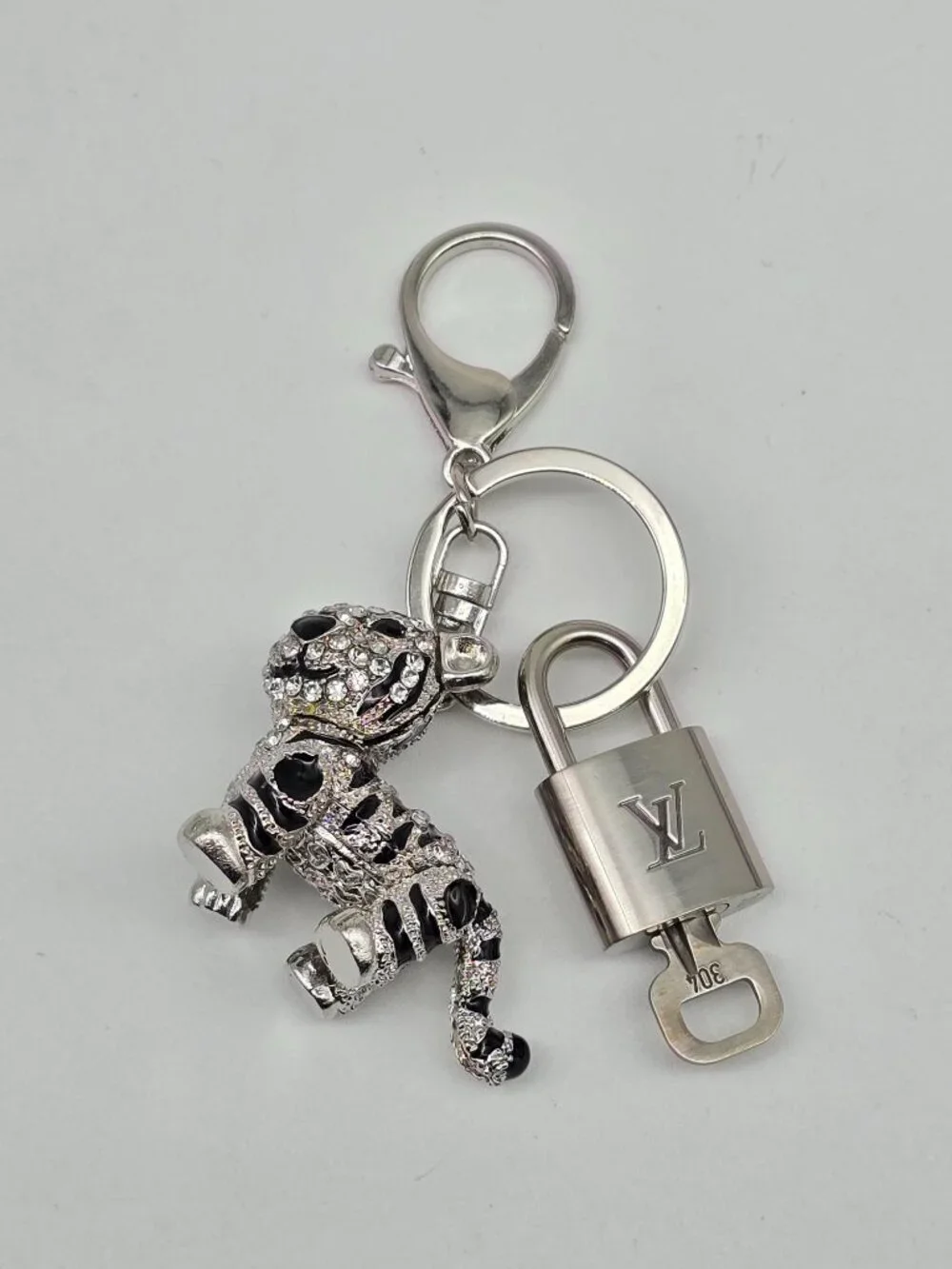 Authentic Louis Vuitton Silver Padlock with Unbranded Silver Tiger Bagcharm